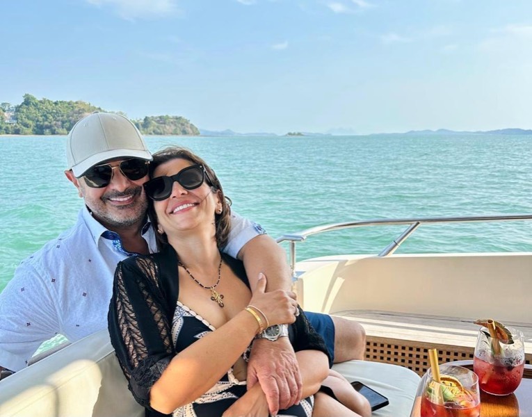 Relaxing on a boat over turquoise water, cocktails at hand