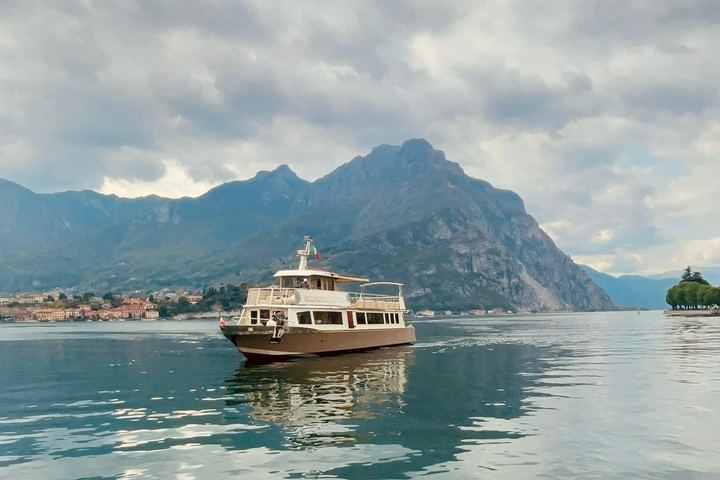 Lady Vittoria, the boat for Saturday evening, alone on Lake Como with the mountains behind
